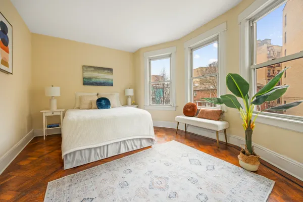 a bed room with a bed and a couch