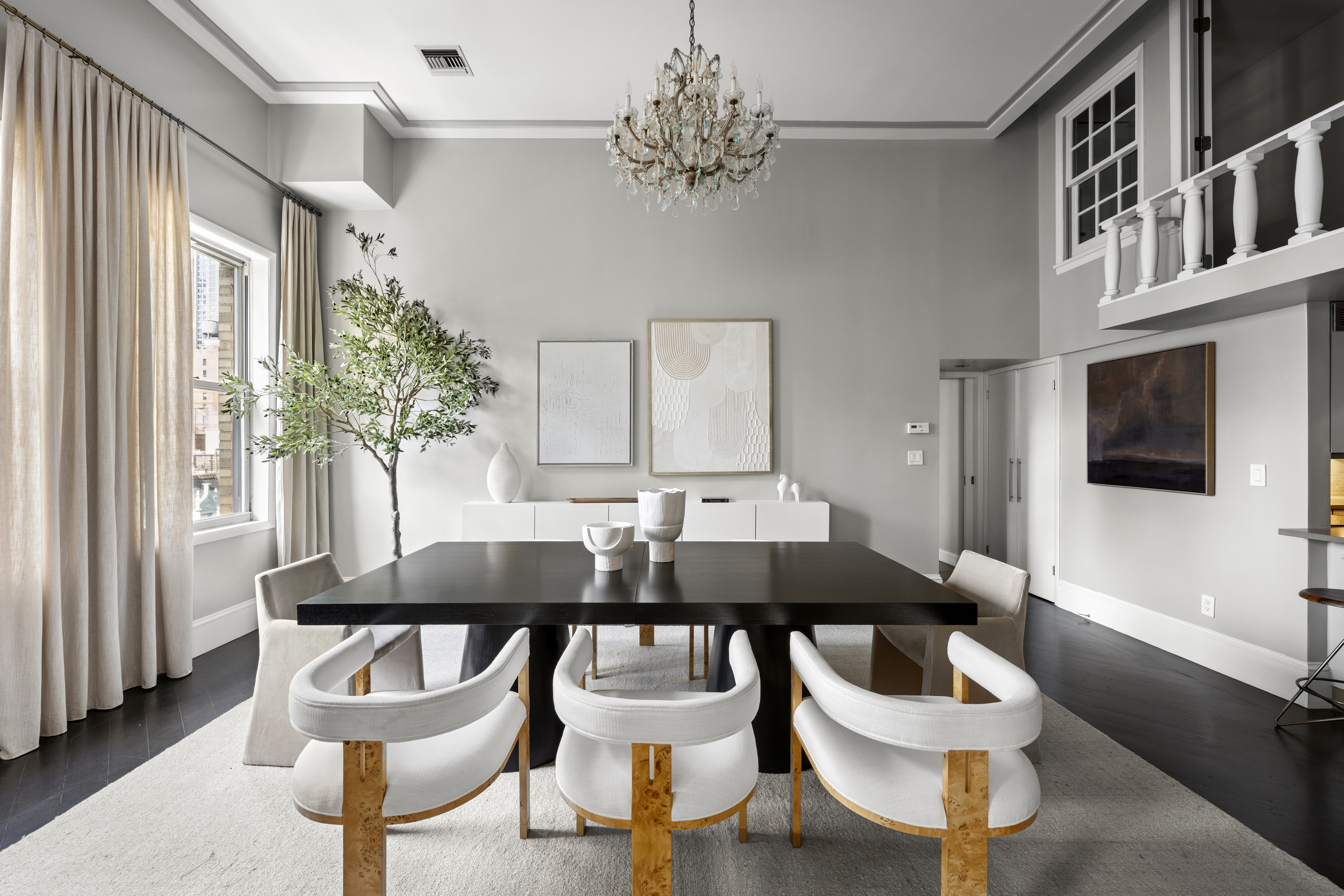253 West 73rd Street, Unit 6B-C Manhattan, NY 10023 - Photo 4 of 21 a view of a dining room with furniture and a chandelier