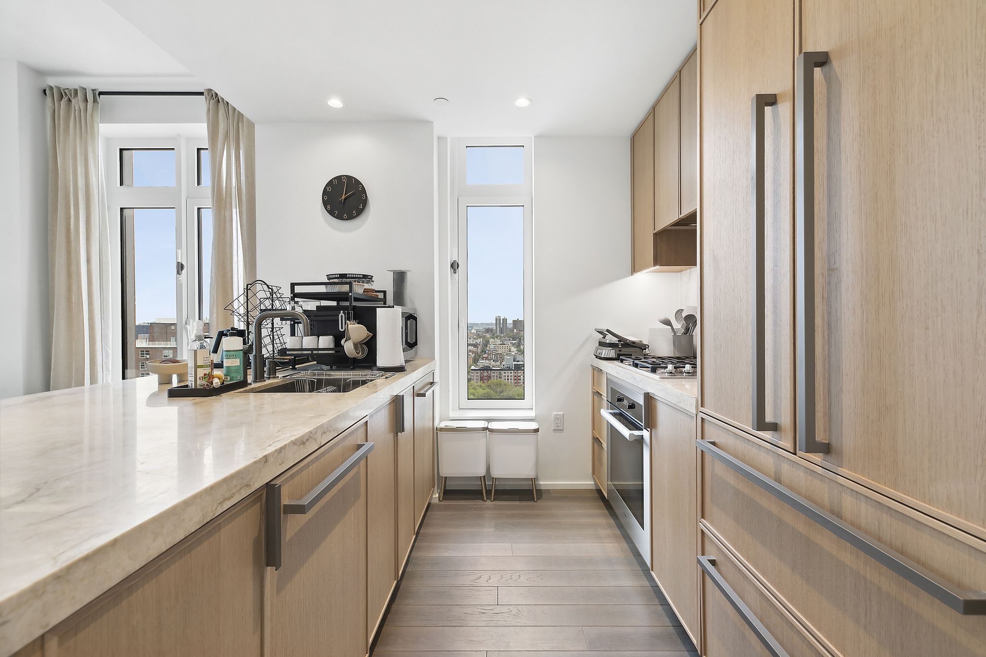 543 West 122nd Street, Unit 17C Manhattan, NY 10027 - Photo 3 of 10 a kitchen with stainless steel appliances granite countertop a refrigerator and a sink
