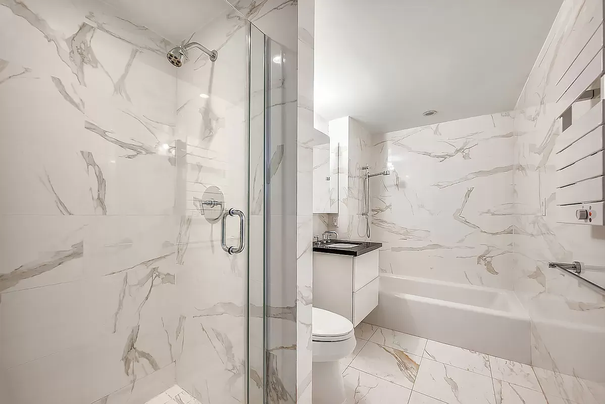 a bathroom with a shower and a toilet