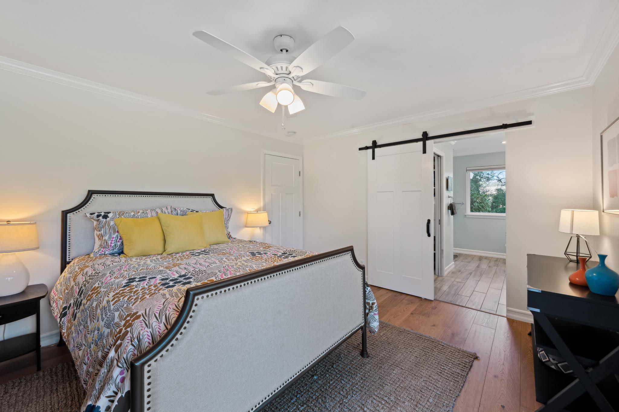 123 Frey Road Santa Rosa, CA 95409 - Photo 37 of 62 a bedroom with a bed and wooden floor