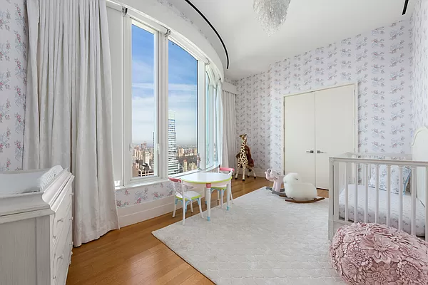 252 East 57th Street, Unit 62B Manhattan, NY 10022 - Photo 8 of 15 a living room with furniture and a window