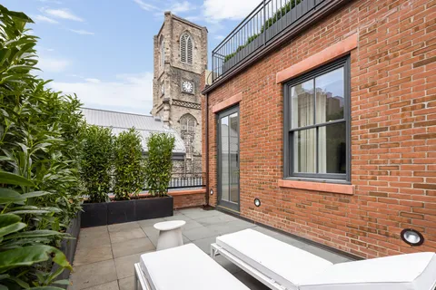 a view of house with backyard