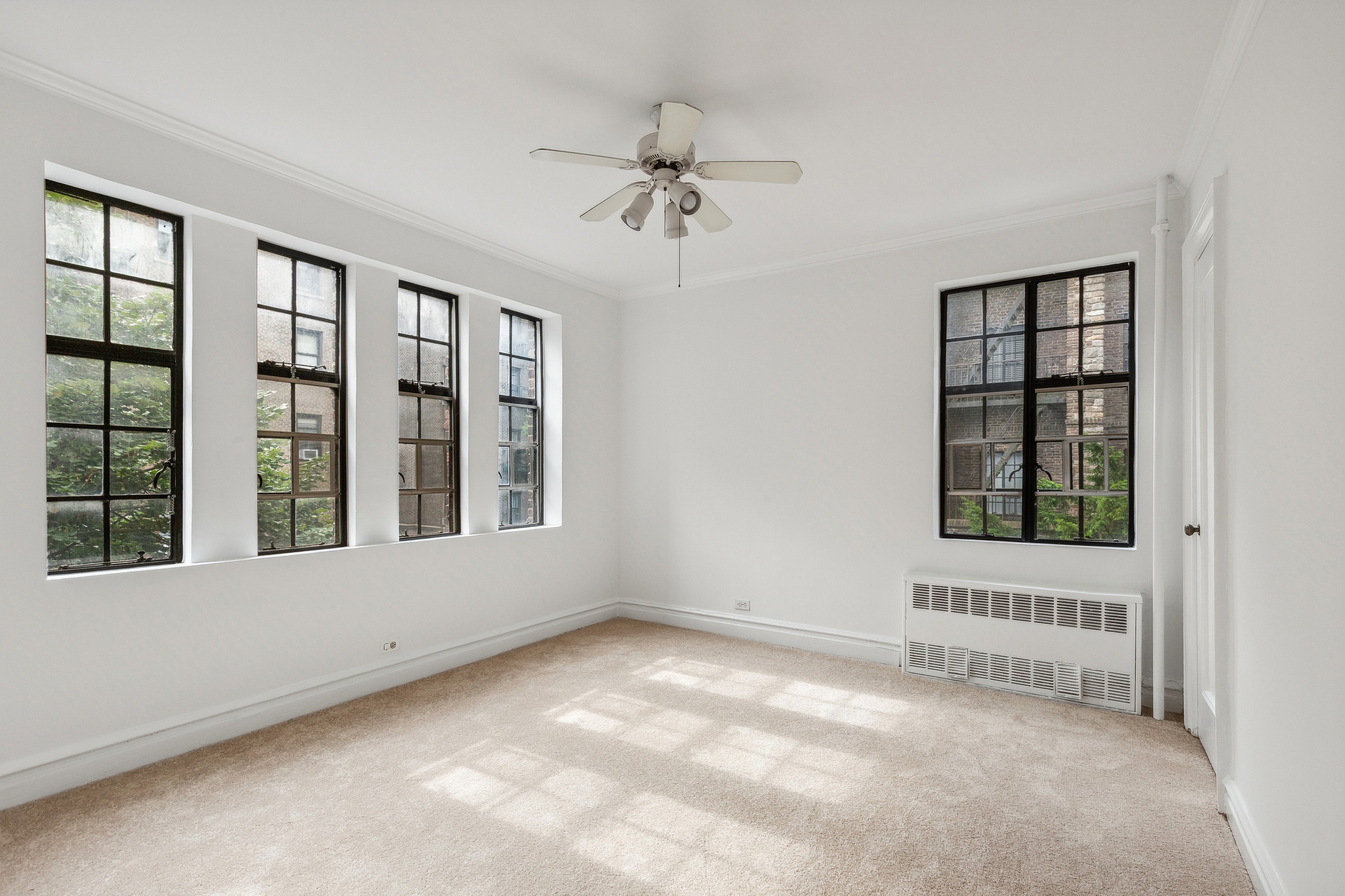116 Pinehurst Avenue, Unit H32 Manhattan, NY 10033 - Photo 10 of 21 a view of an empty room with a window