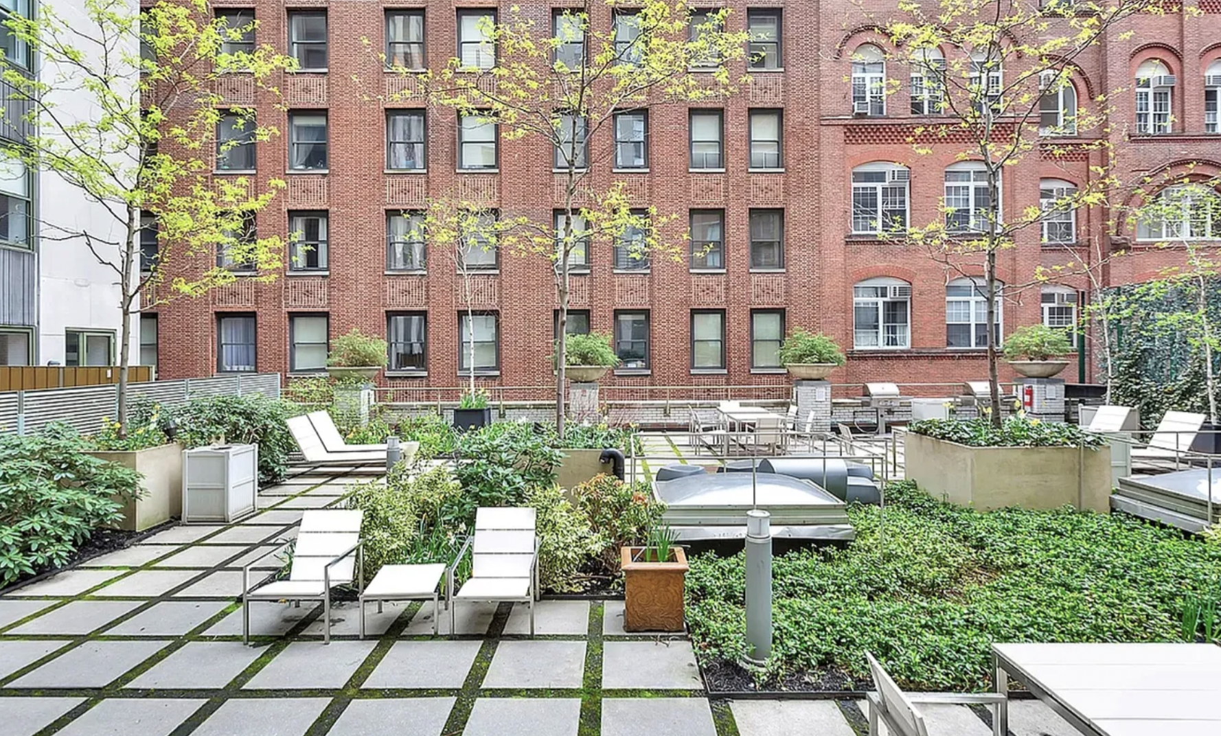 99 John Street, Unit 1102 Manhattan, NY 10038 - Photo 9 of 12 a view of a patio with couches table and chairs and potted plants