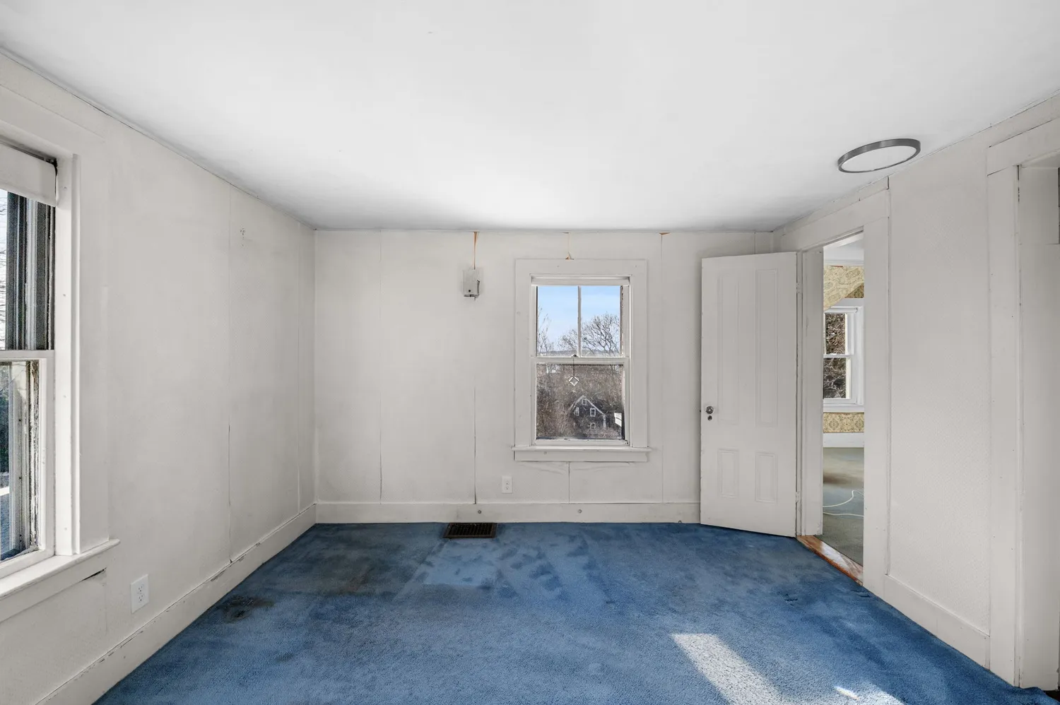 a picture of a bench in front of a wall