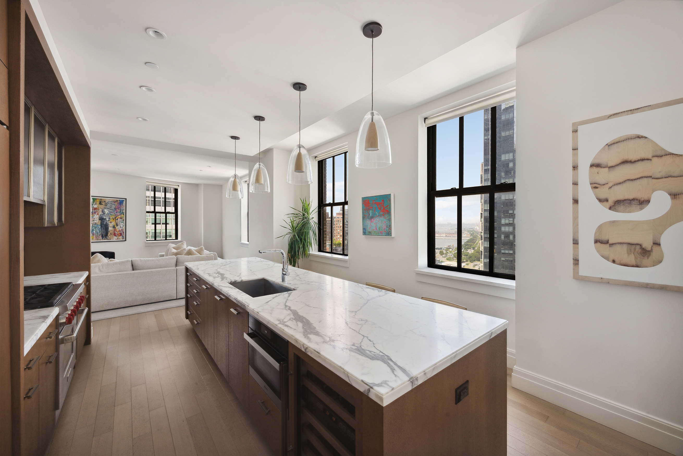 a kitchen with granite countertop a stove and a sink
