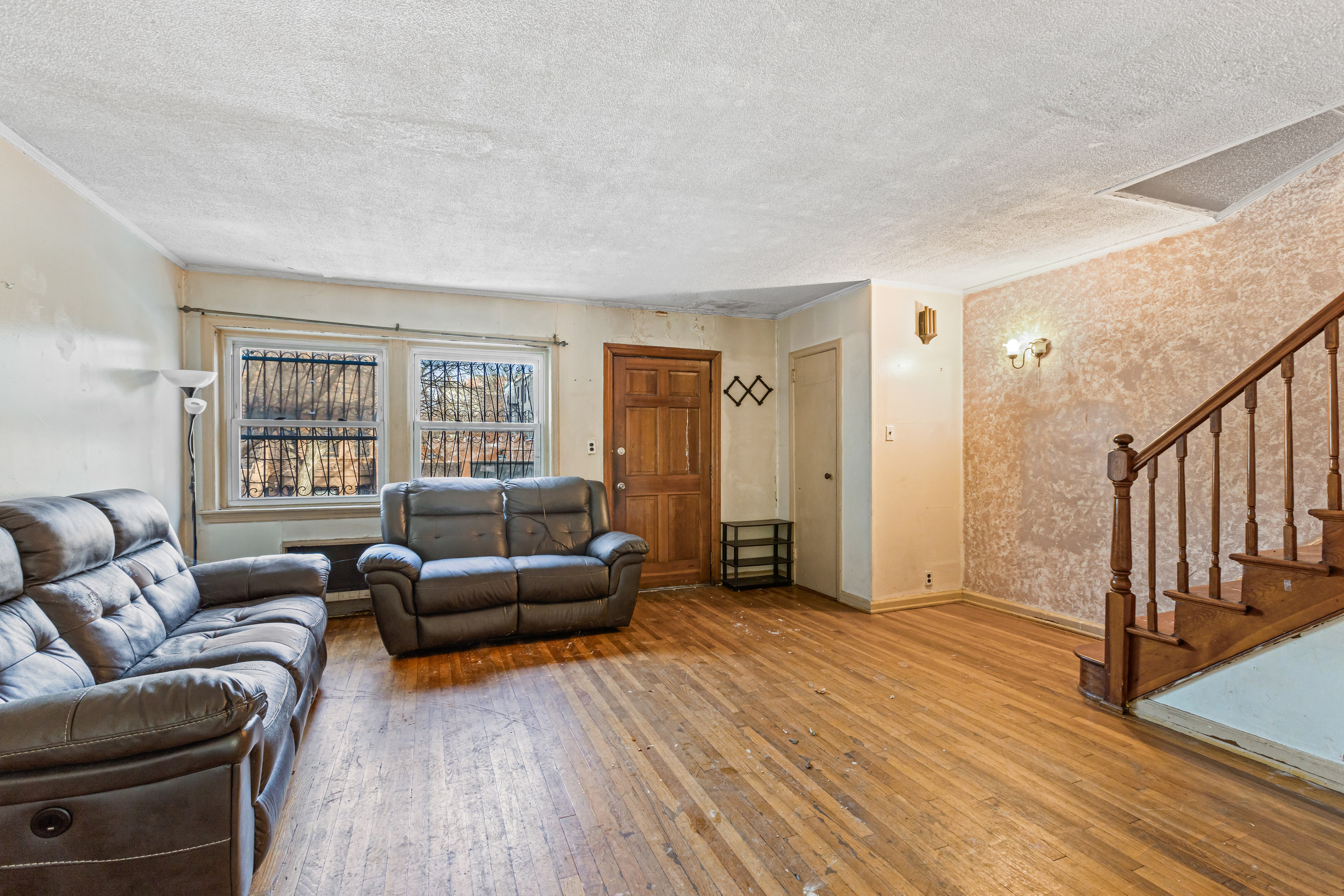 4802 6th Avenue Brooklyn, NY 11220 - Photo 12 of 21 a living room with furniture and a wooden floor
