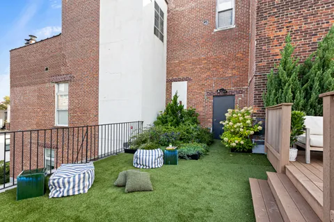 a view of a chair and table in the patio
