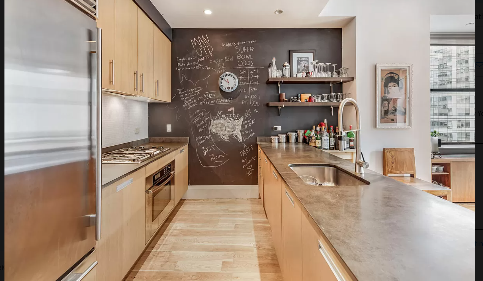 71 Nassau Street, Unit 12C Manhattan, NY 10038 - Photo 6 of 18 a kitchen with stainless steel appliances granite countertop a refrigerator a stove and a sink with dishwasher