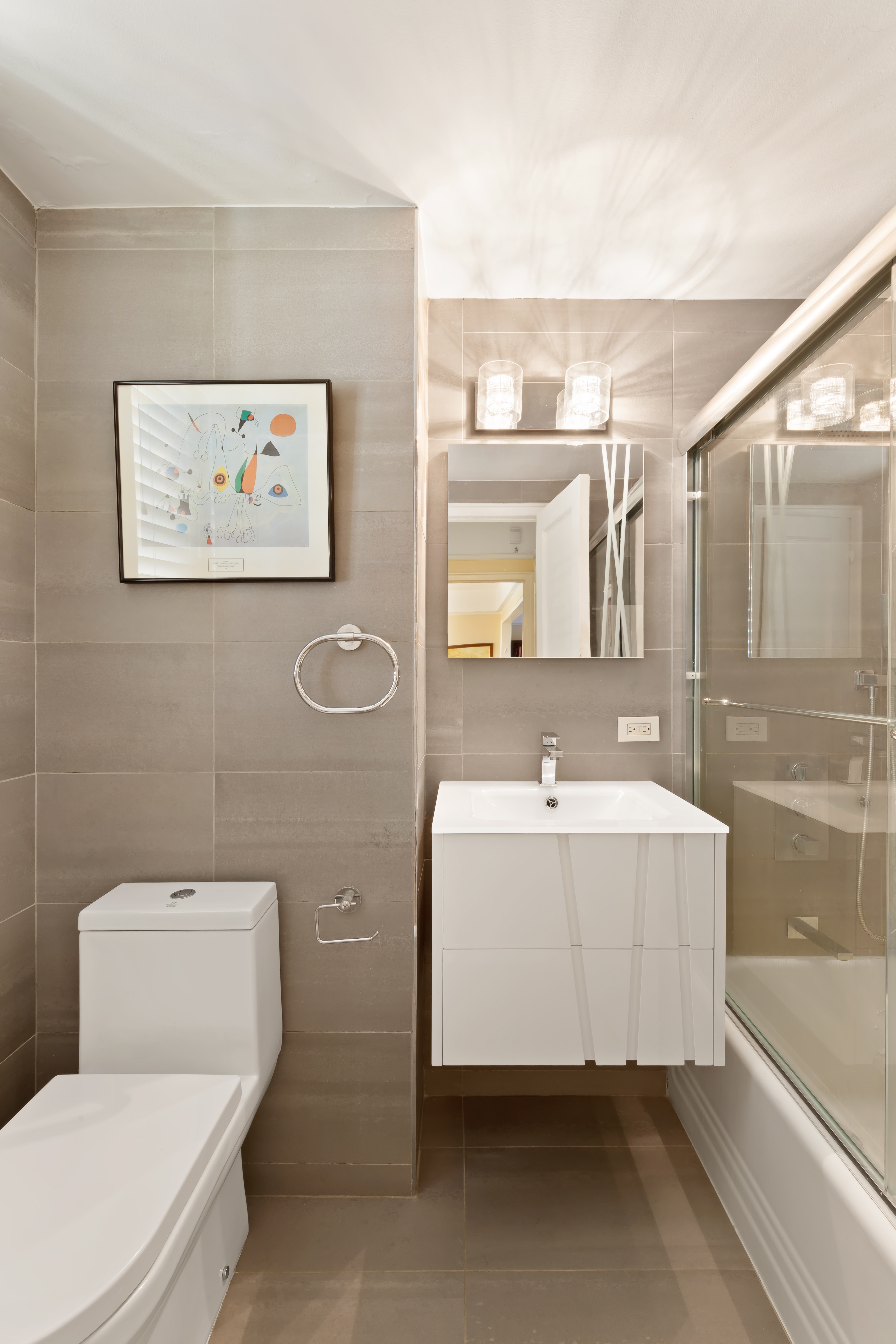 160 Cabrini Boulevard, Unit 19 Manhattan, NY 10033 - Photo 10 of 27 a bathroom with a sink mirror bathtub and toilet