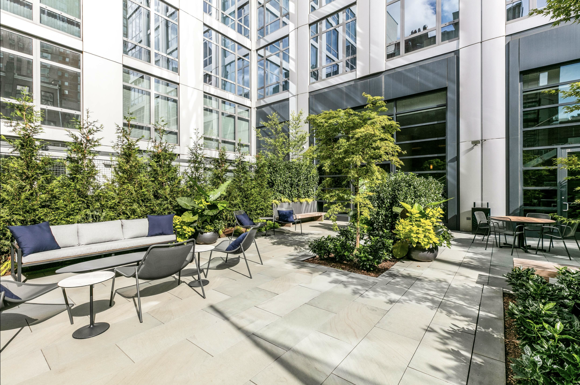 310 West 52nd Street, Unit 5F Manhattan, NY 10019 - Photo 11 of 13 a view of a chair and table in the patio of the house