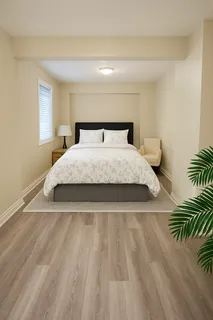 a bedroom with a bed and a large mirror