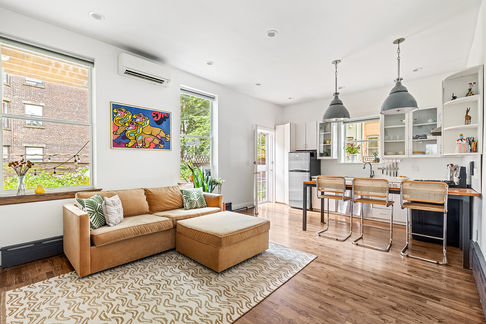 110 Clinton Avenue, Unit 1C Brooklyn, NY 11205 - Photo 1 of 12 a living room with furniture fireplace and a window