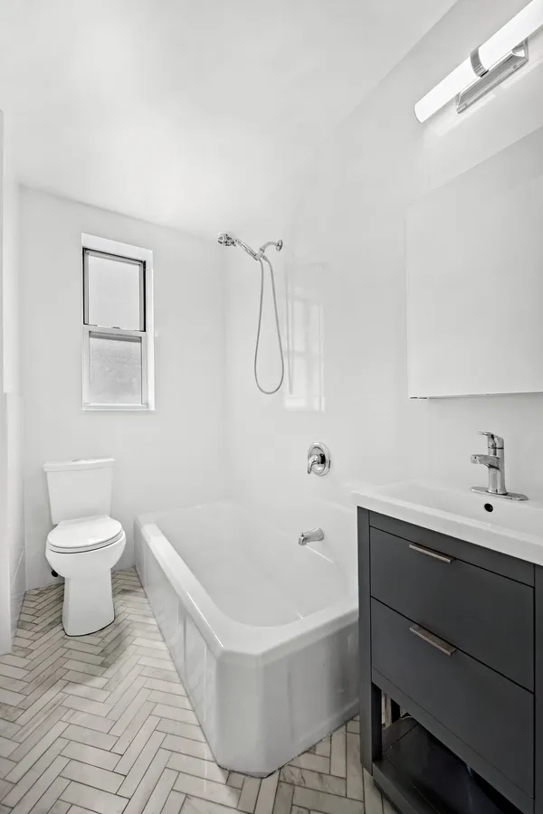 a bathroom with a sink toilet and a bathtub
