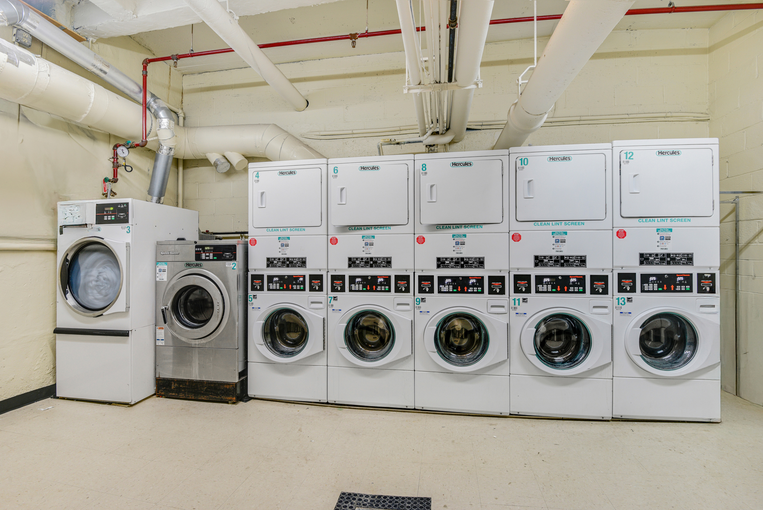 88 Bleecker Street, Unit 5J Manhattan, NY 10012 - Photo 17 of 18 a utility room with dryer and washer