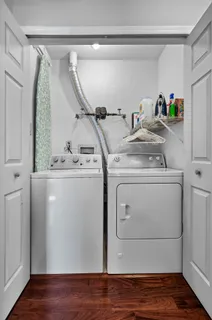 a utility room with closet dryer and washer