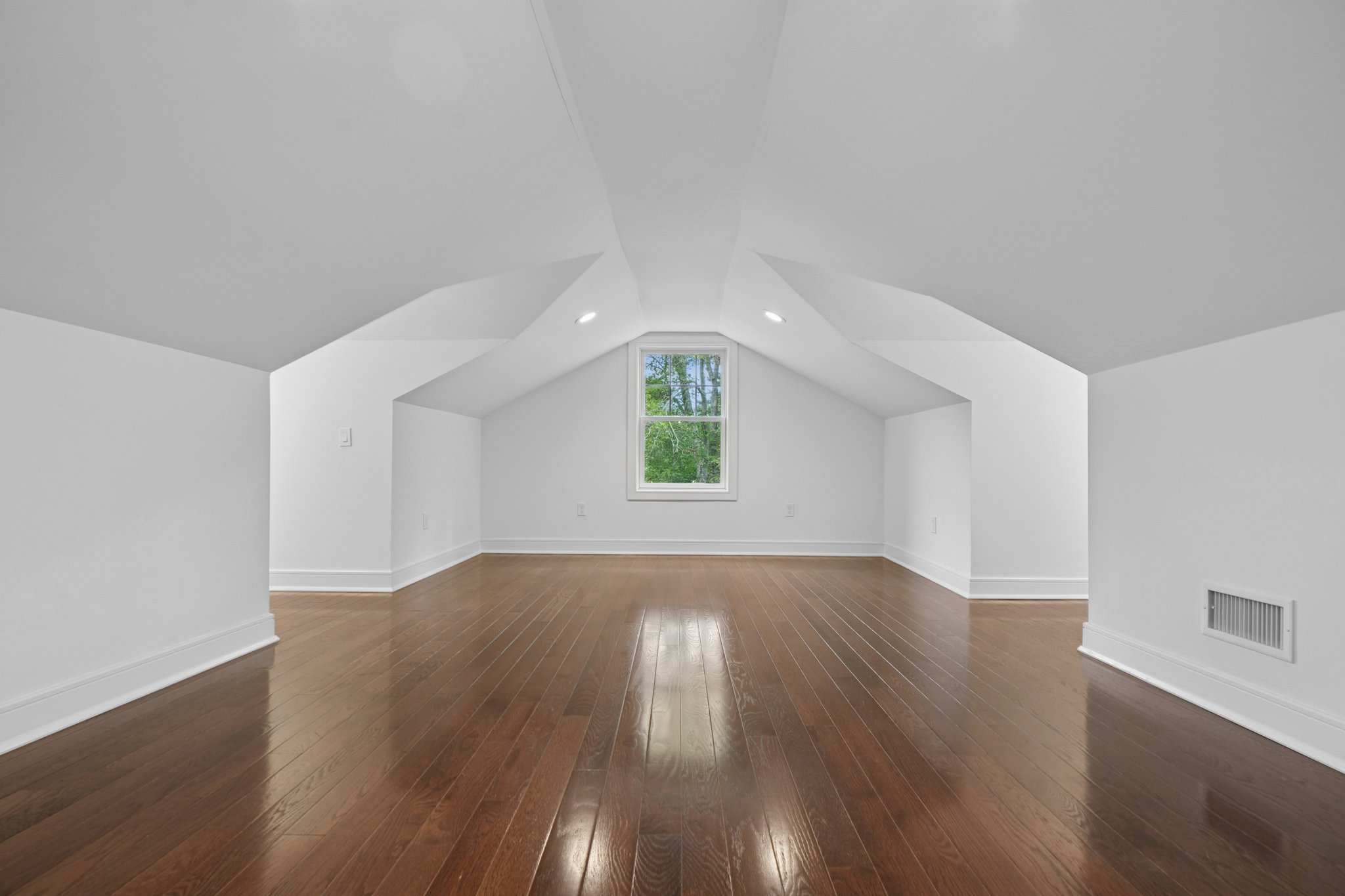 823 River Road Chatham, NJ 07928 - Photo 41 of 60 an empty room with wooden floor and windows