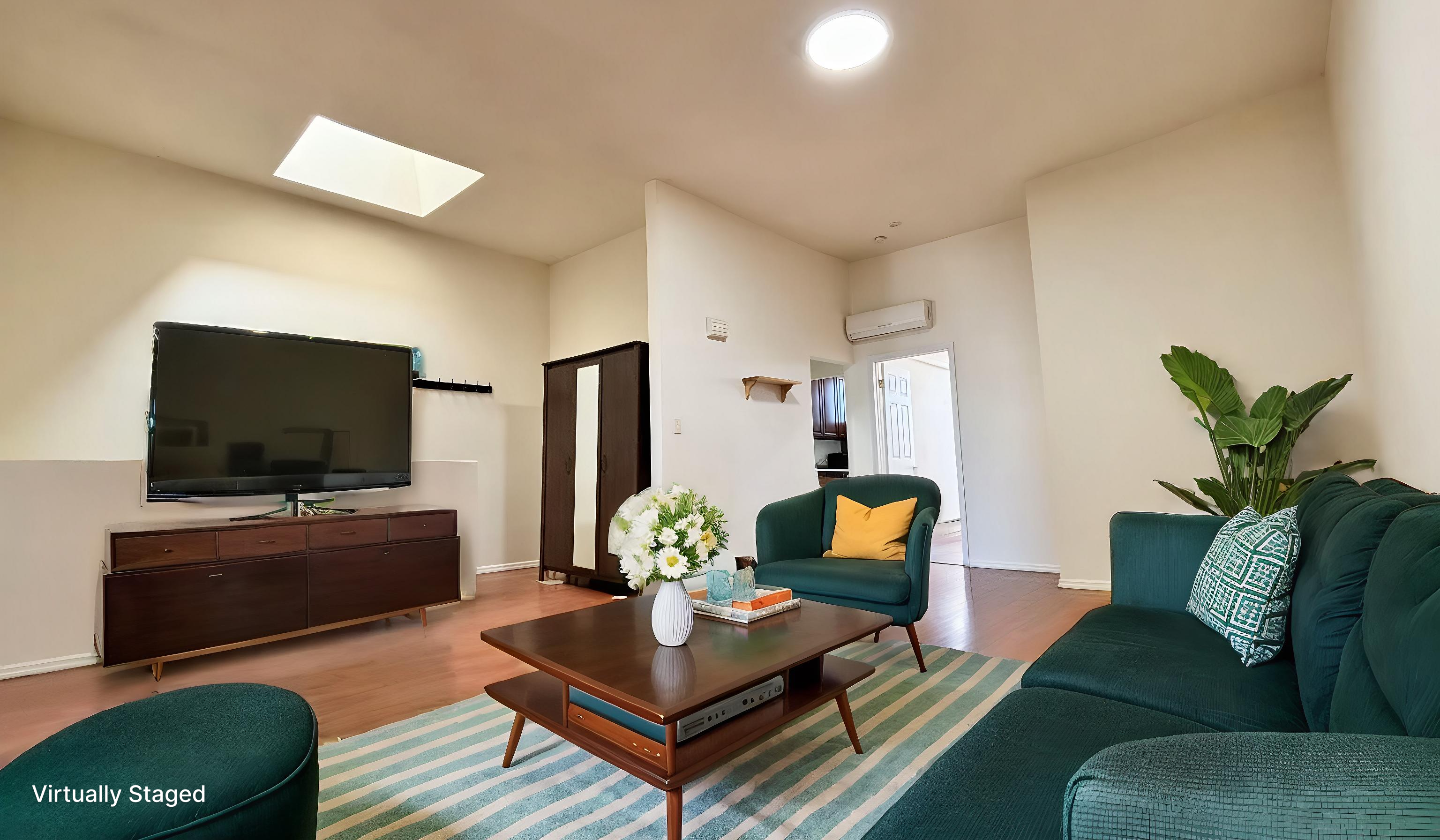 a living room with furniture and a flat screen tv