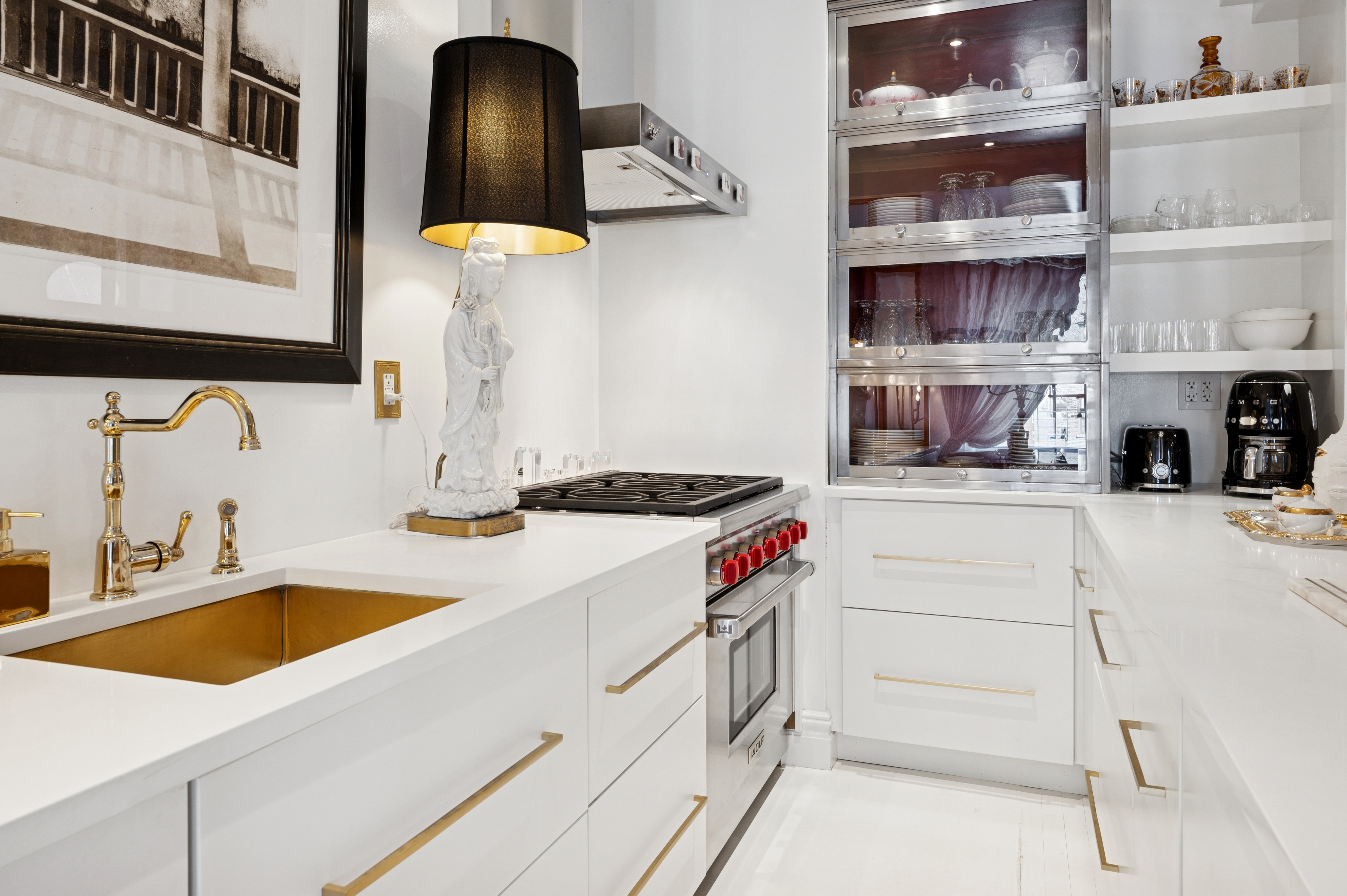 891 Park Avenue, Unit 10 Manhattan, NY 10075 - Photo 8 of 27 a kitchen with a sink and cabinets