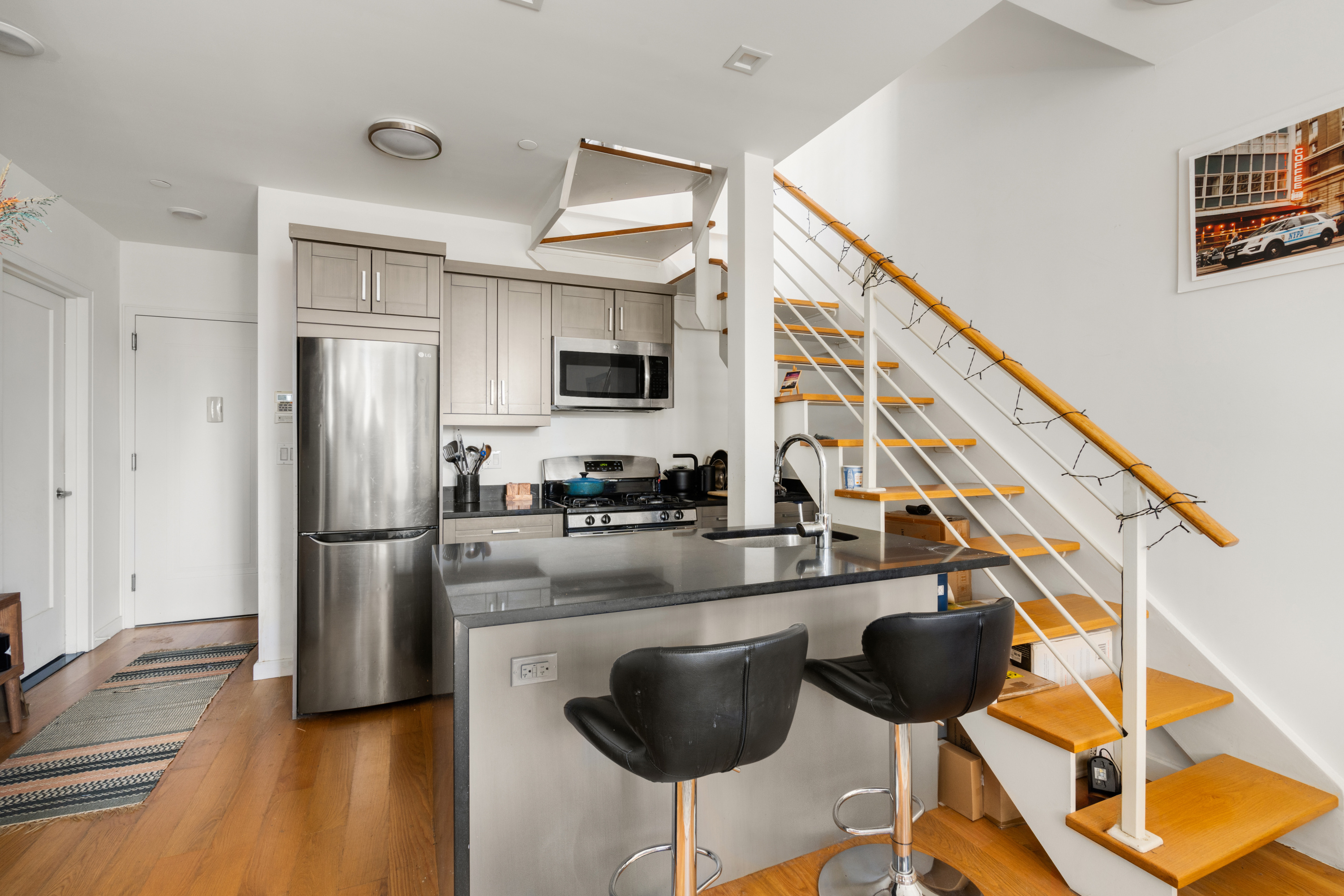 721 Metropolitan Avenue, Unit 4L Brooklyn, NY 11211 - Photo 2 of 7 a kitchen with stainless steel appliances granite countertop a refrigerator a stove a sink and dishwasher