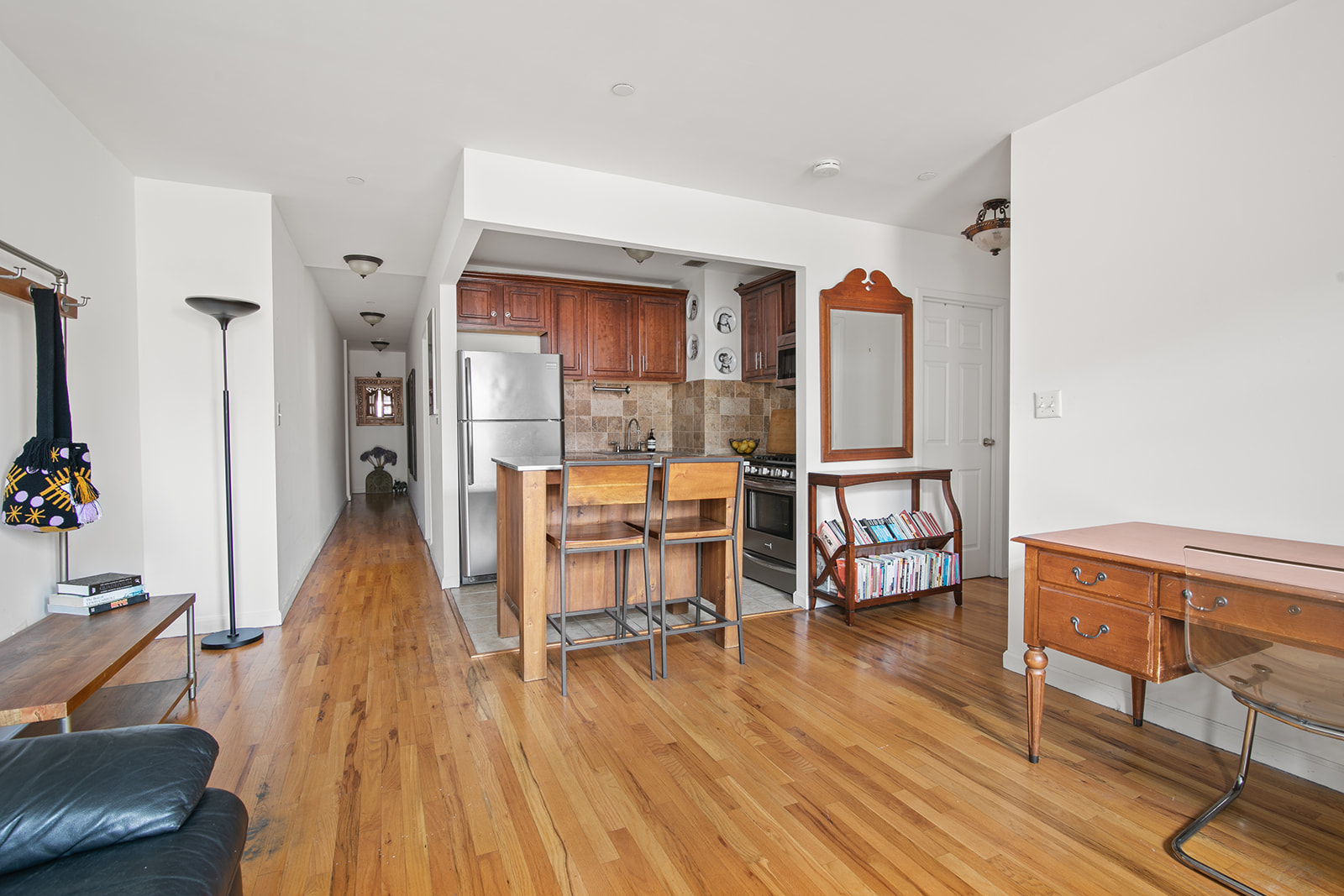 660 St Nicholas Avenue, Unit 54 Manhattan, NY 10030 - Photo 3 of 9 a dining room with furniture and wooden floor