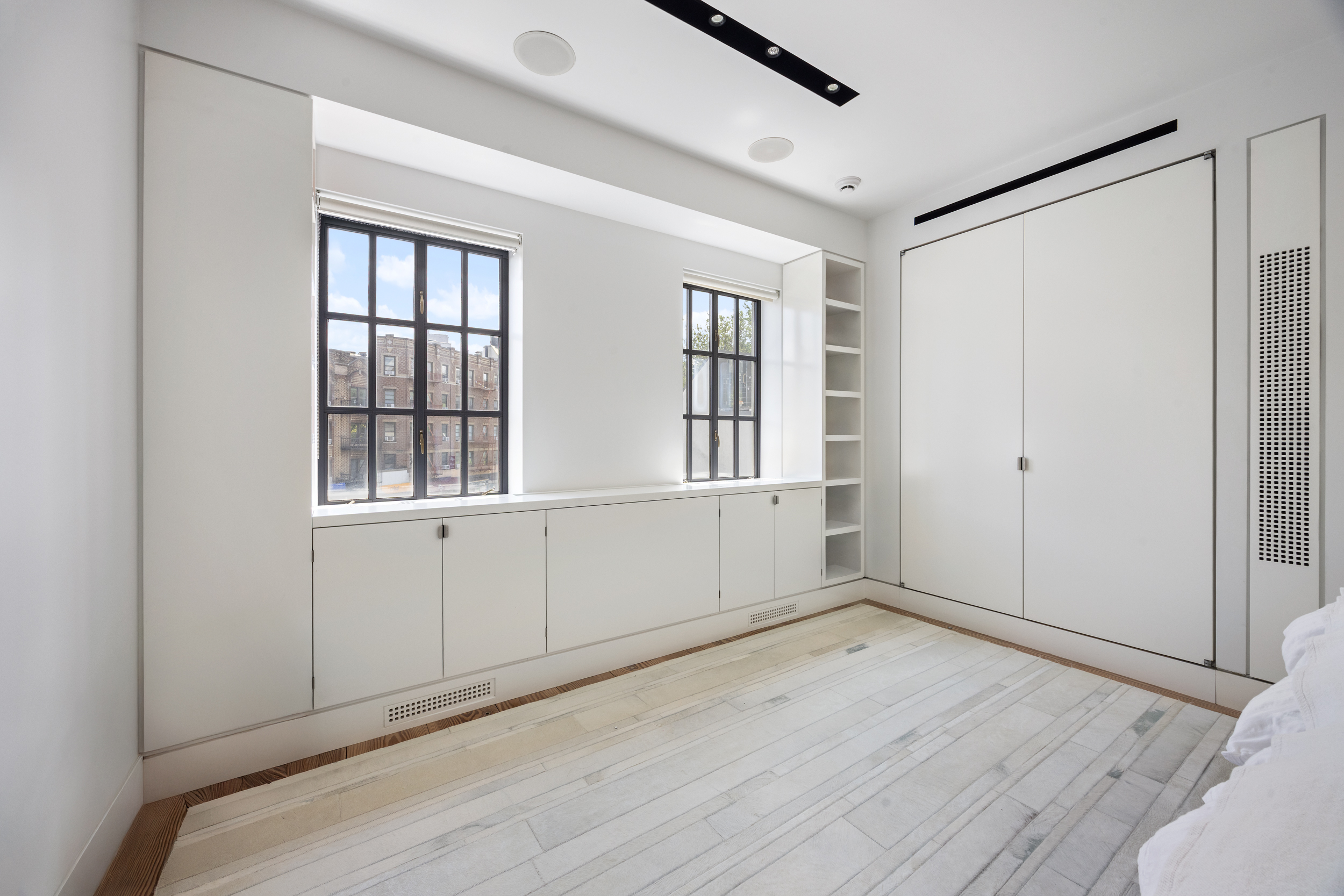 39 Barrow Street Manhattan, NY 10014 - Photo 25 of 39 wooden floor in an empty room with a window