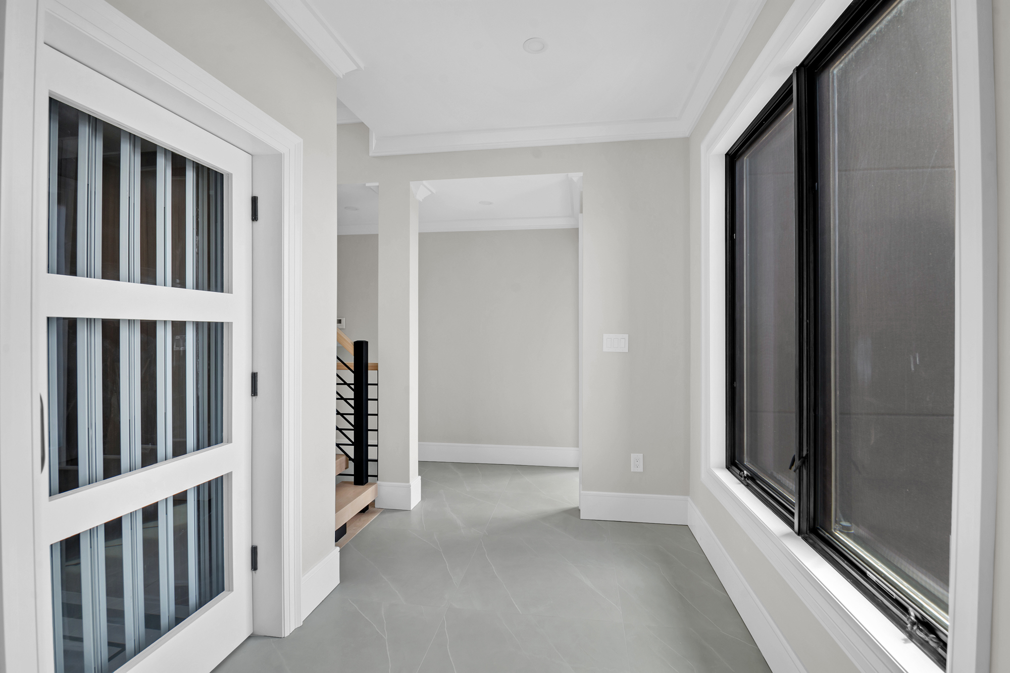 5 Osprey Court Staten Island, NY 10308 - Photo 44 of 50 a view of a hallway with wooden shelves
