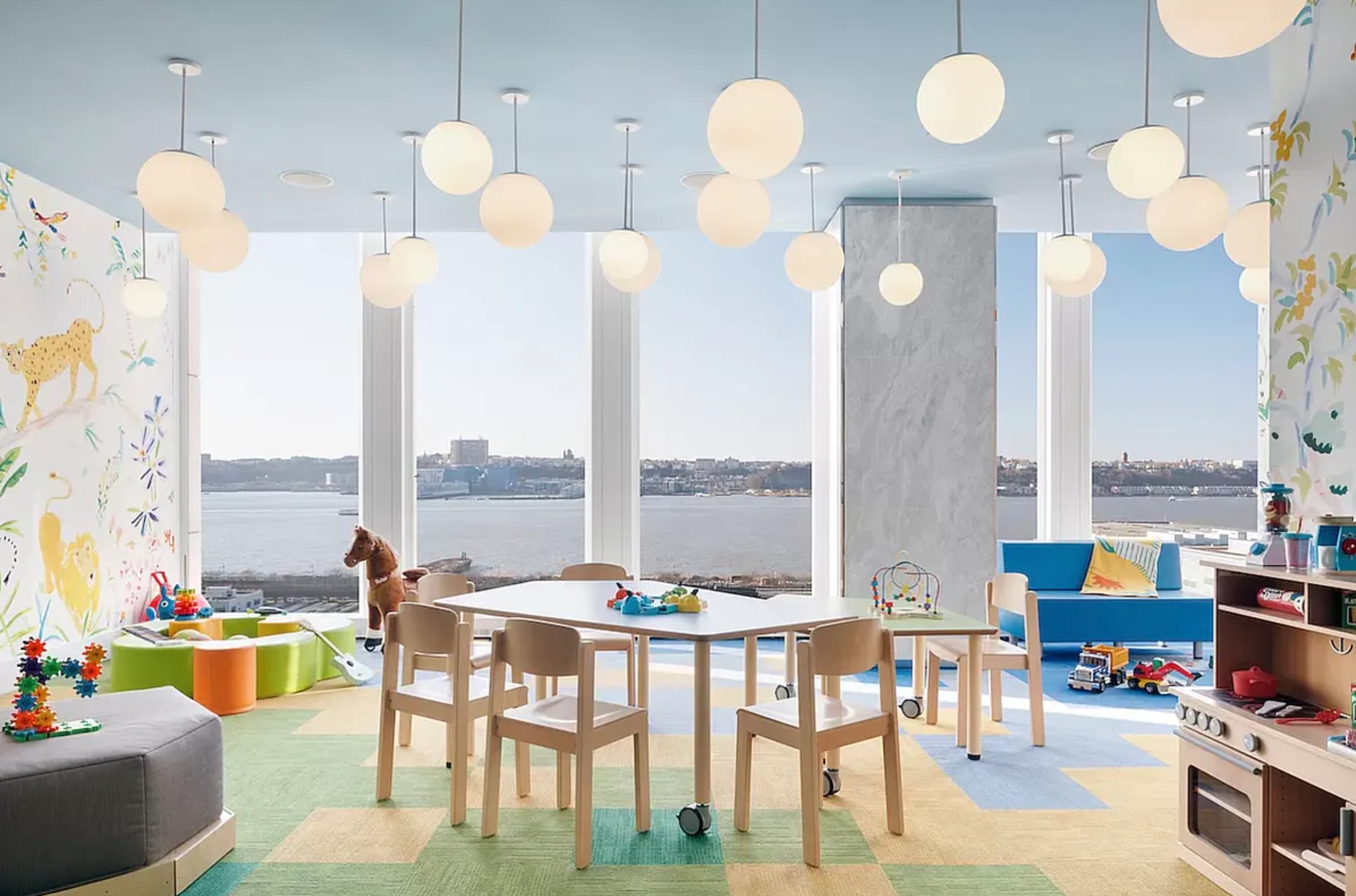 35 Hudson Yards, Unit 6701 Manhattan, NY 10001 - Photo 22 of 23 a very nice looking dining room with a large dining table chairs and large windows