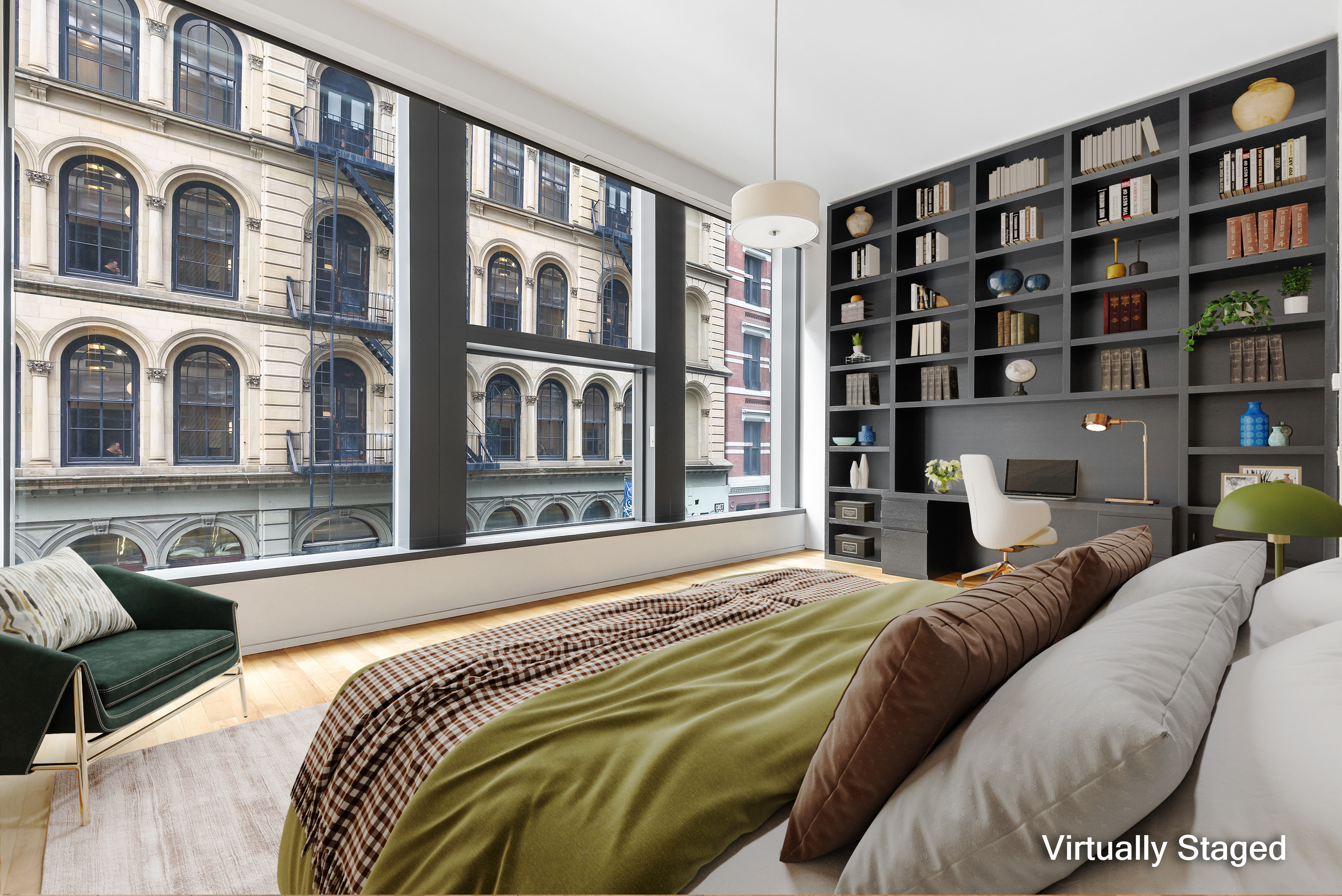 40 Mercer Street, Unit 19 Manhattan, NY 10013 - Photo 4 of 16 a bedroom with a bed couch and a book shelf