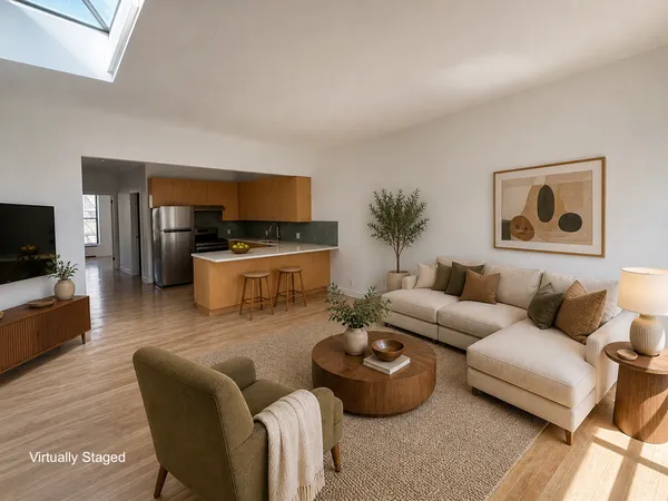 a living room with furniture wooden floor and a flat screen tv