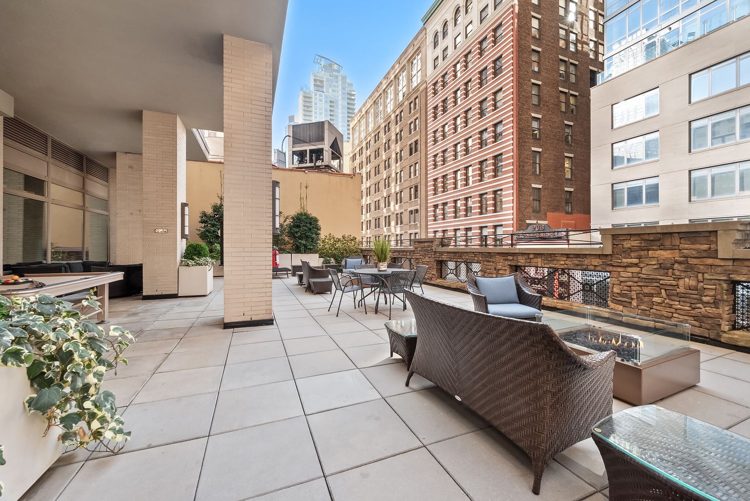 35 West 33rd Street, Unit 26A Manhattan, NY 10001 - Photo 14 of 28 a view of a patio with dining table and chairs
