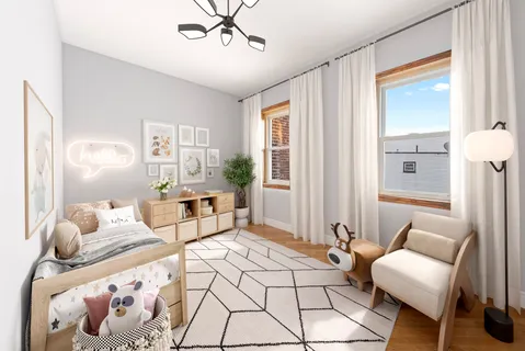 a bedroom with furniture and wooden floor