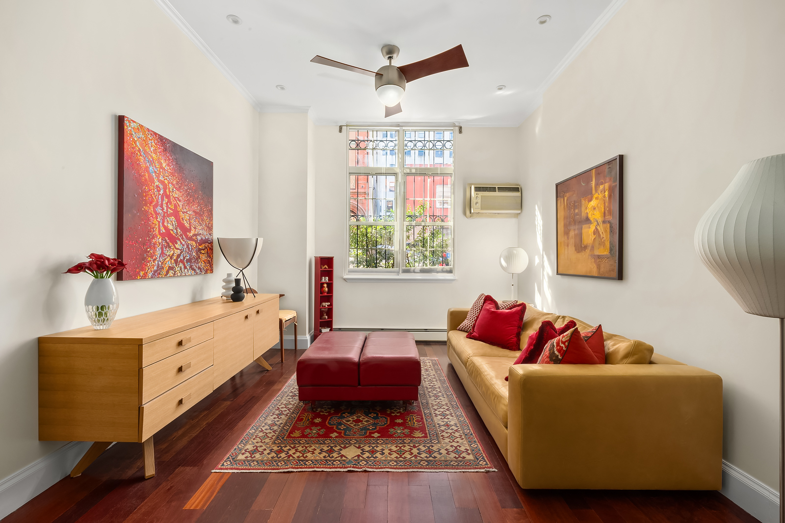 163 St Nicholas Avenue, Unit 1I Manhattan, NY 10026 - Photo 2 of 12 a living room with furniture and a window