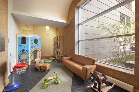 a bedroom with furniture and a window