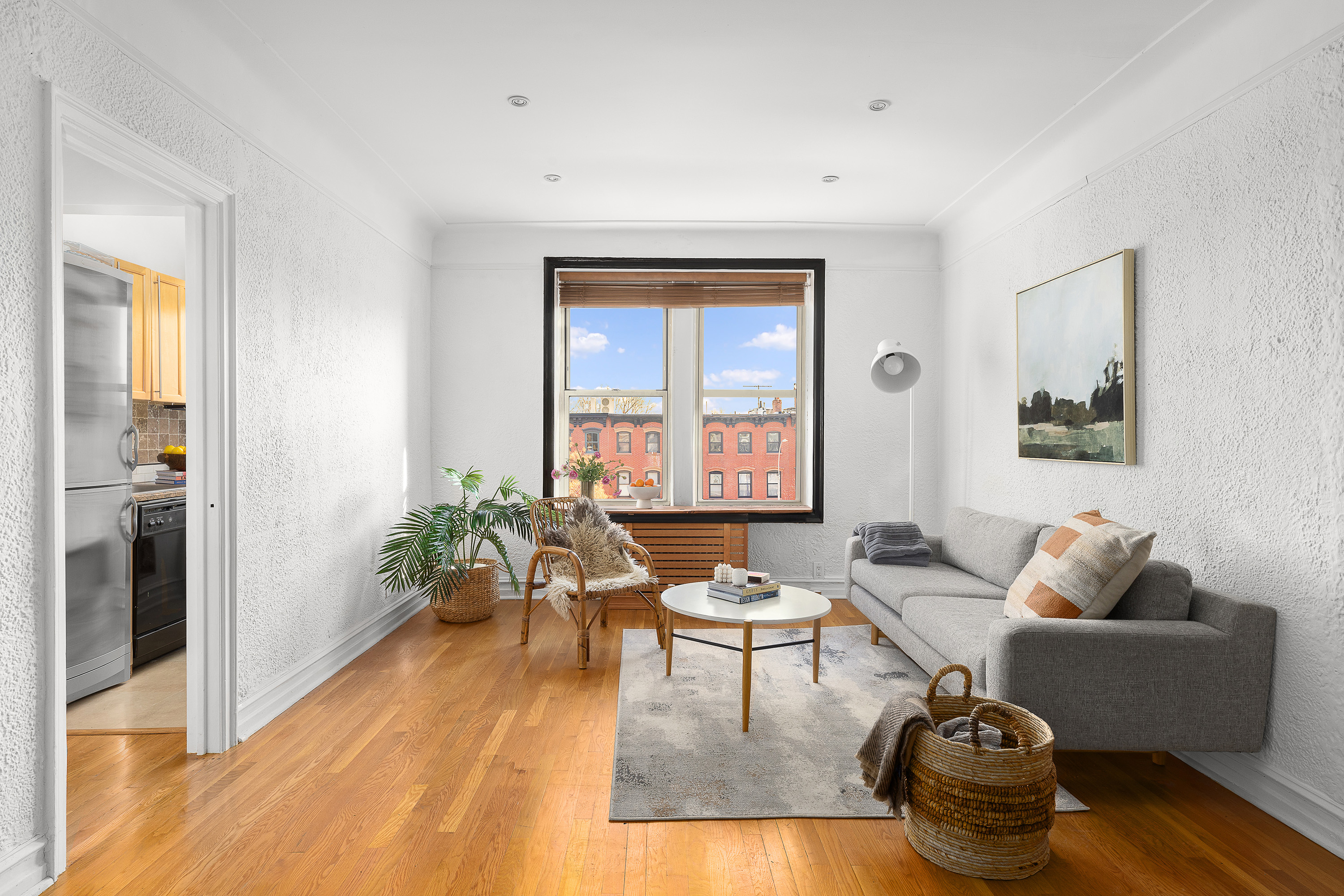 a living room with furniture and a window