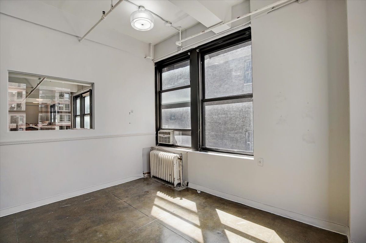 146 West 29th Street, Unit 9W Manhattan, NY 10001 - Photo 6 of 10 a view of an empty room with a window