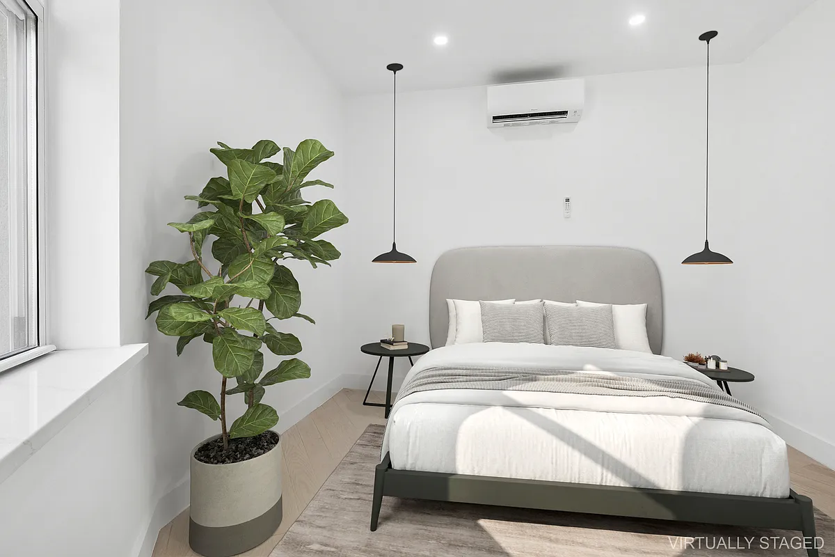 457 Bergen Street, Unit 2F Brooklyn, NY 11217 - Photo 10 of 12 a bedroom with a bed and a potted plant