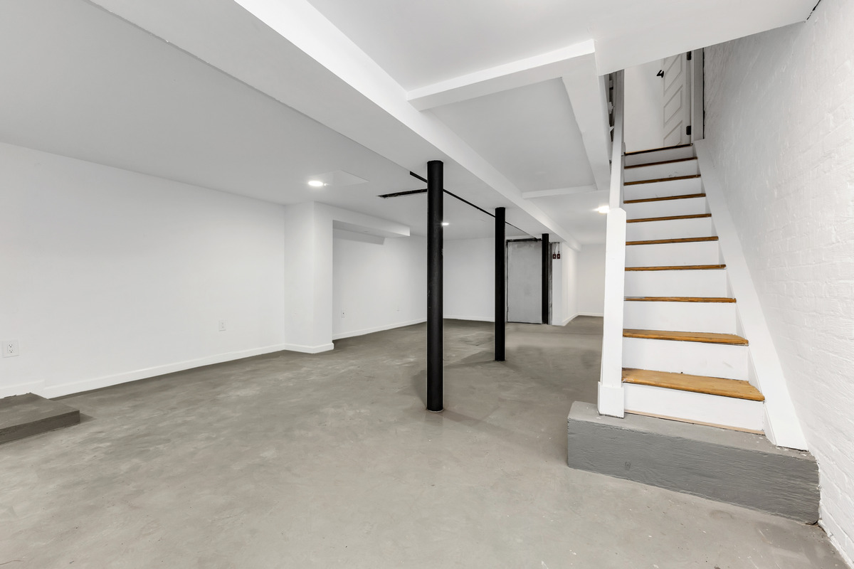 574 Gates Avenue Brooklyn, NY 11221 - Photo 9 of 16 a view of an empty room with stairs