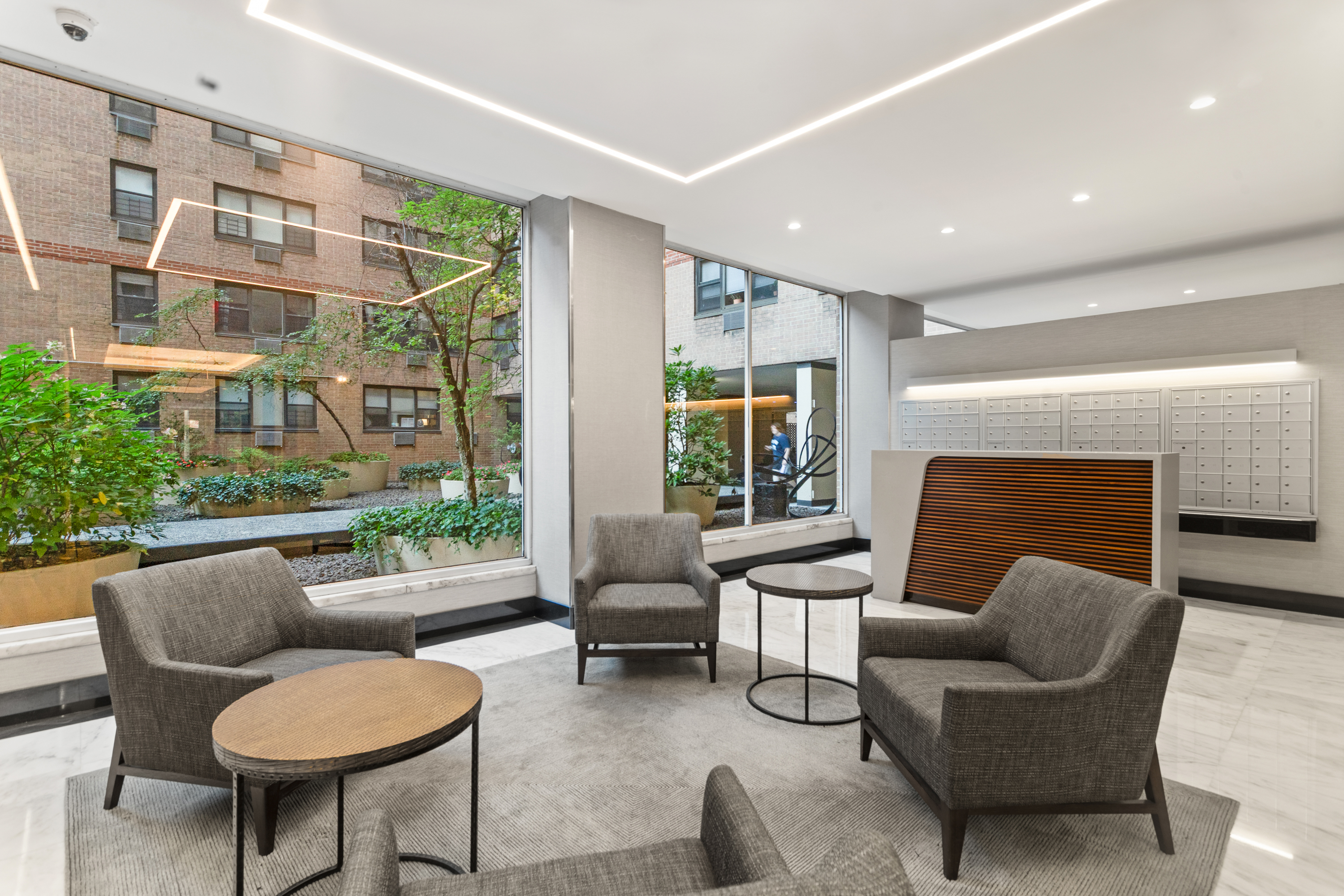 333 East 79th Street, Unit 7P Manhattan, NY 10075 - Photo 9 of 13 a living room with furniture and a fireplace
