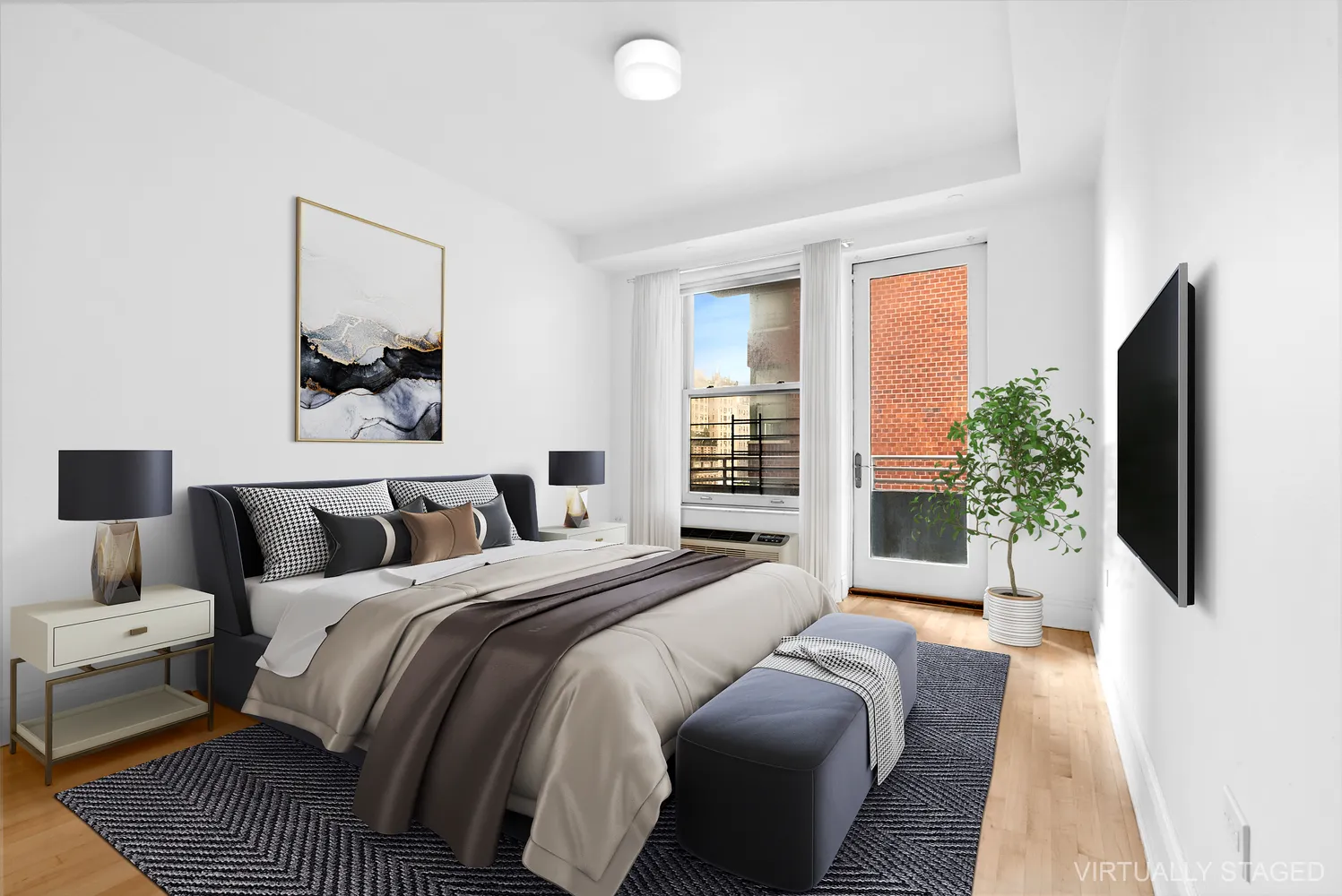 a bedroom with a bed and a flat screen tv