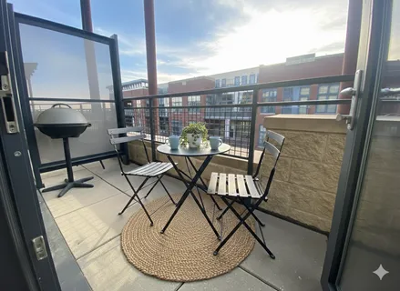 a view of a balcony with chairs