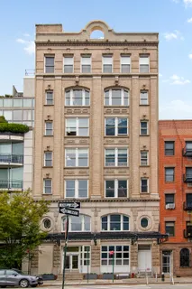 a front view of a building with glass windows