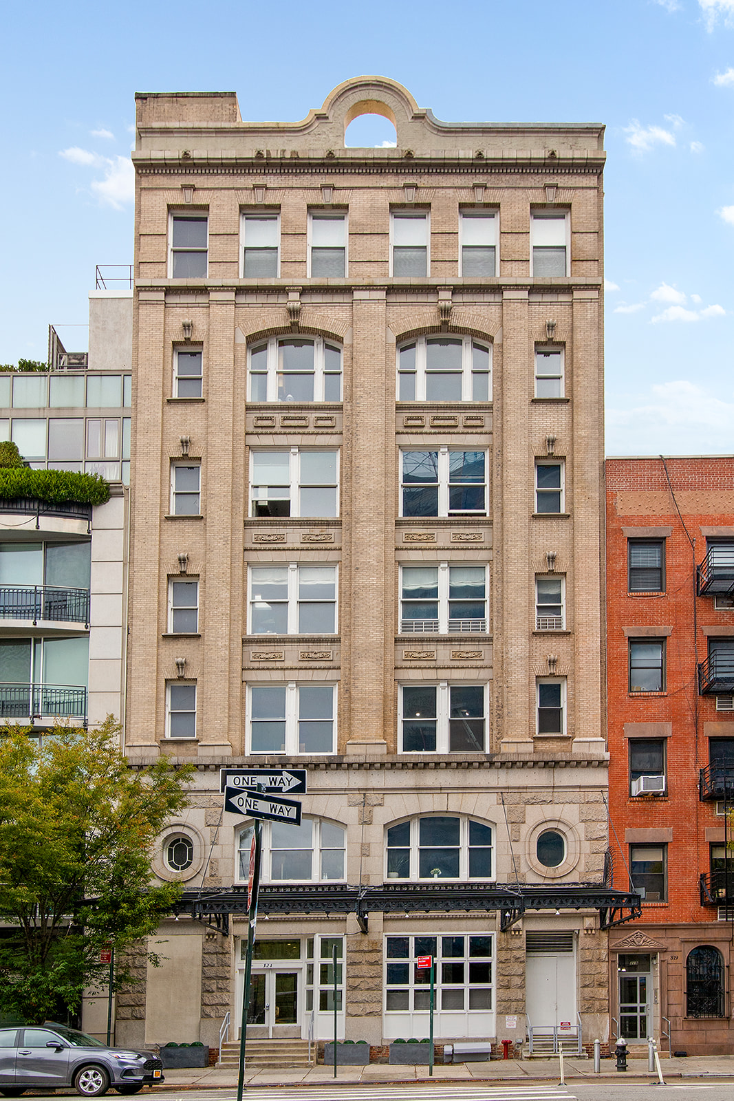 321 West 13th Street, Unit 3A Manhattan, NY 10014 - Photo 11 of 12 a front view of a building with glass windows