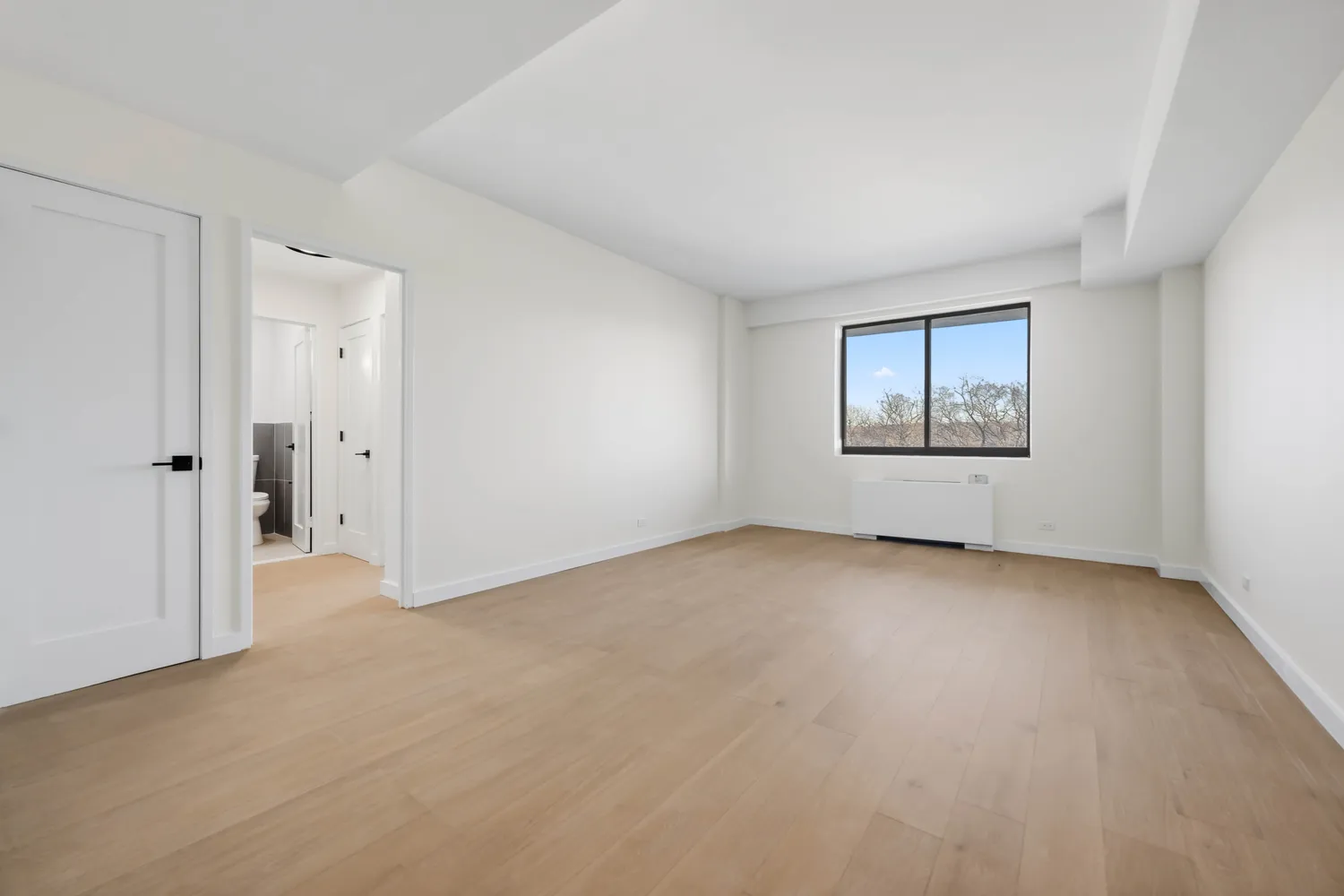 a view of an empty room with a window