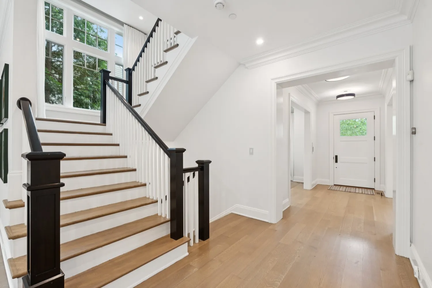 a white bath tub sitting in a spacious bathroom