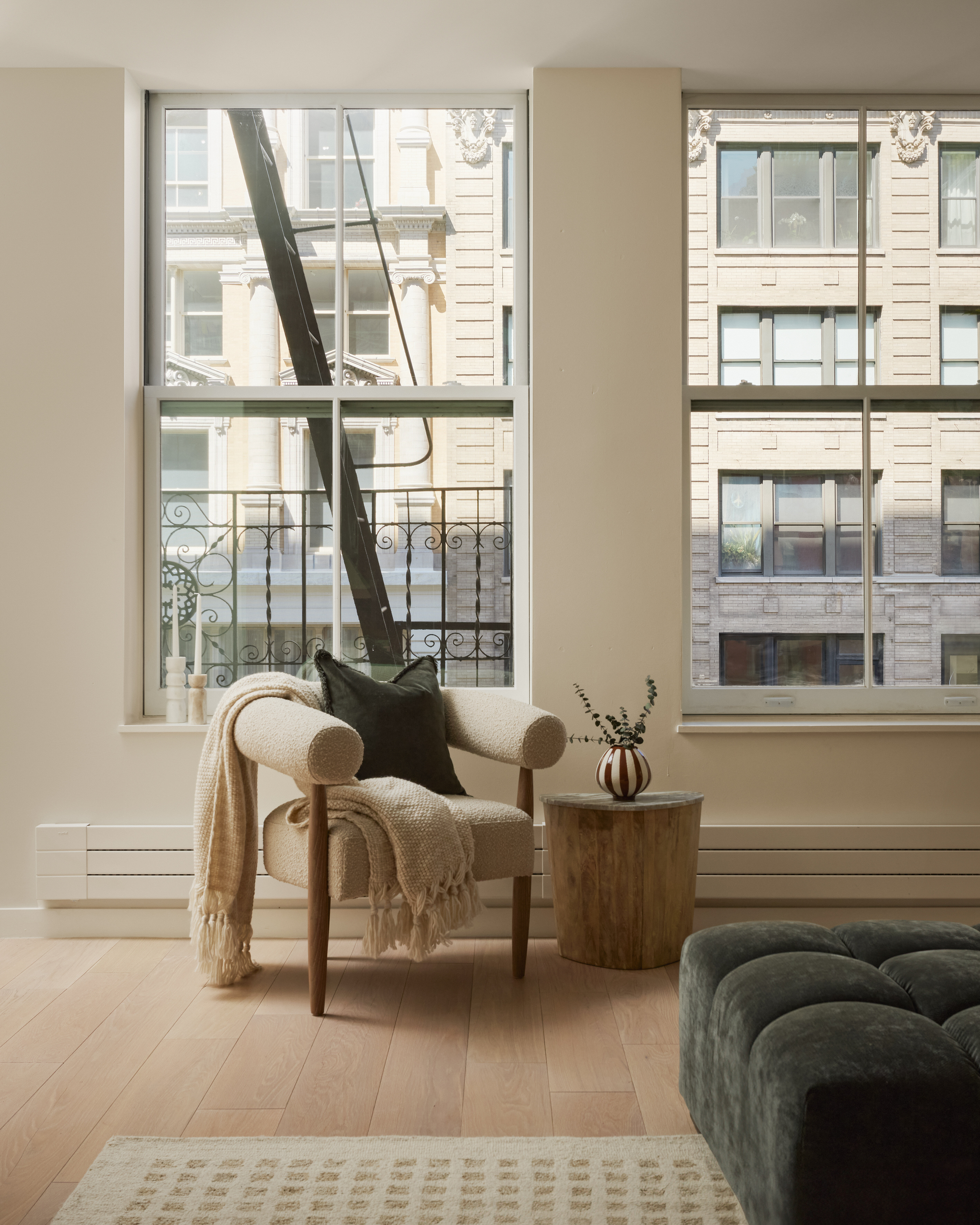 112 Hudson Street, Unit 3 Manhattan, NY 10013 - Photo 10 of 11 a living room with furniture and a large window