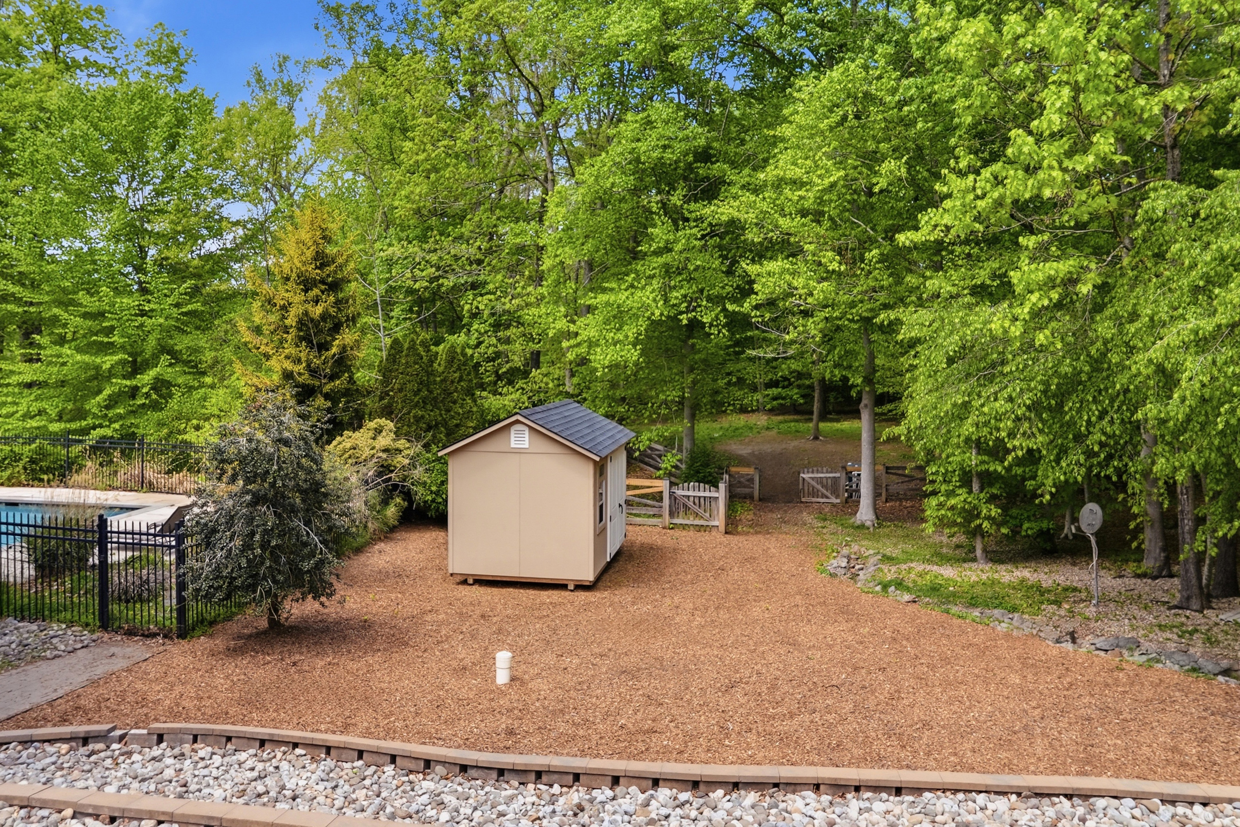5061 Wolf Run Shoals Road Woodbridge, VA 22192 - Photo 14 of 18 a backyard of a house with table and chairs