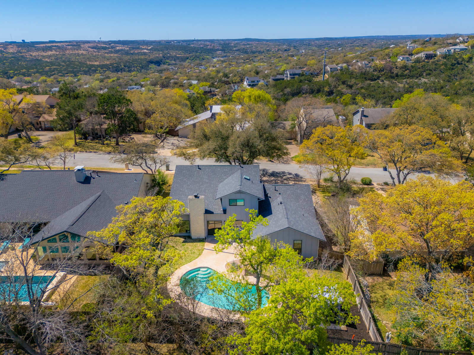 1317 Thaddeus Cove Austin, TX 78746 - Photo 20 of 22 an aerial view of residential houses with outdoor space