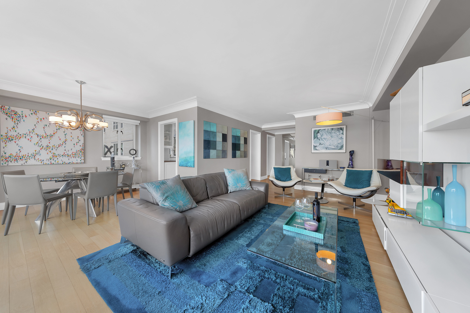 200 East 66th Street, Unit A407 Manhattan, NY 10065 - Photo 2 of 24 a living room with furniture and a large window